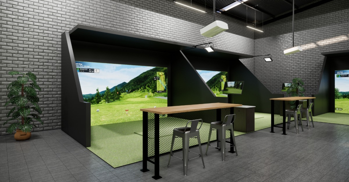 An indoor golf simulator room with a turf hitting area, projection screen, seating, and modern overhead lights.